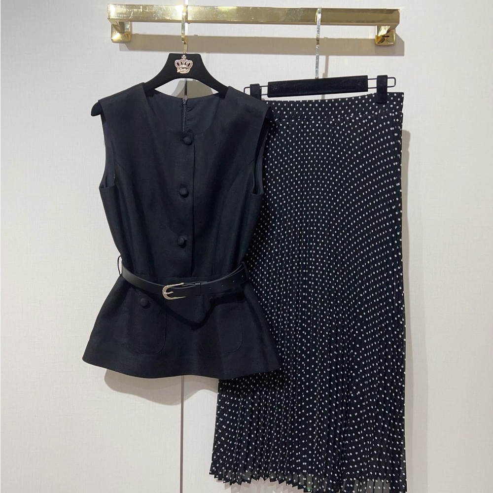 Black Sleeveless Top with Black Polka Dot Pleated Skirt